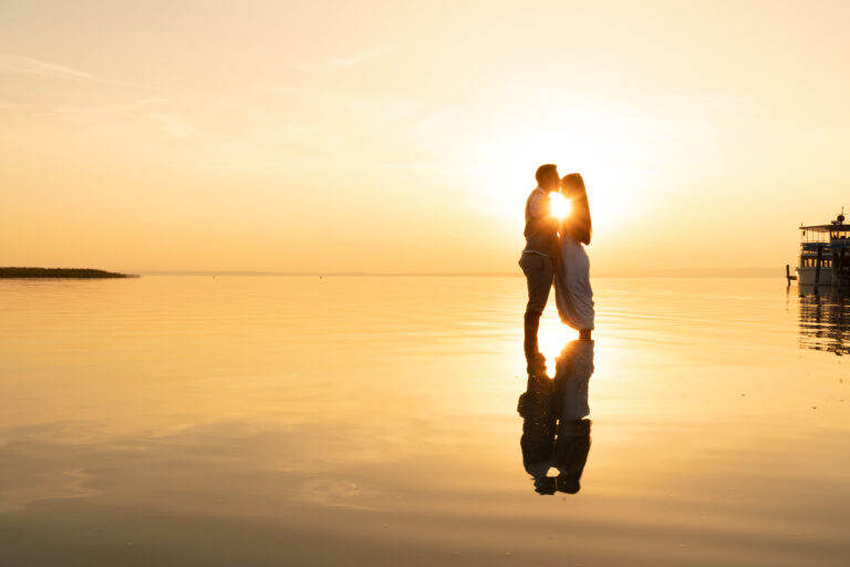 wedding videography wedding couple silhouette on water in sunset